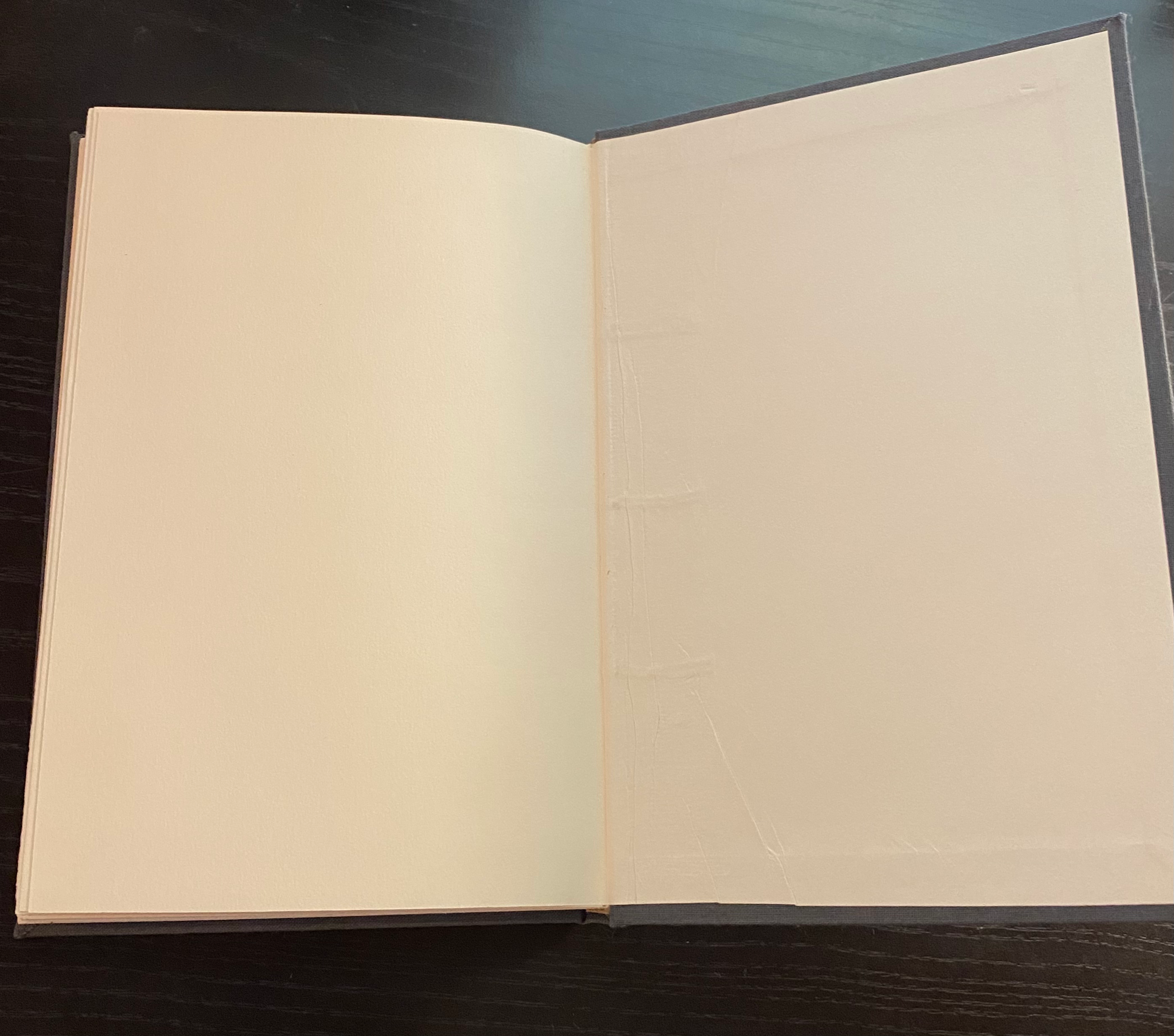 Gray bound book opened to end page