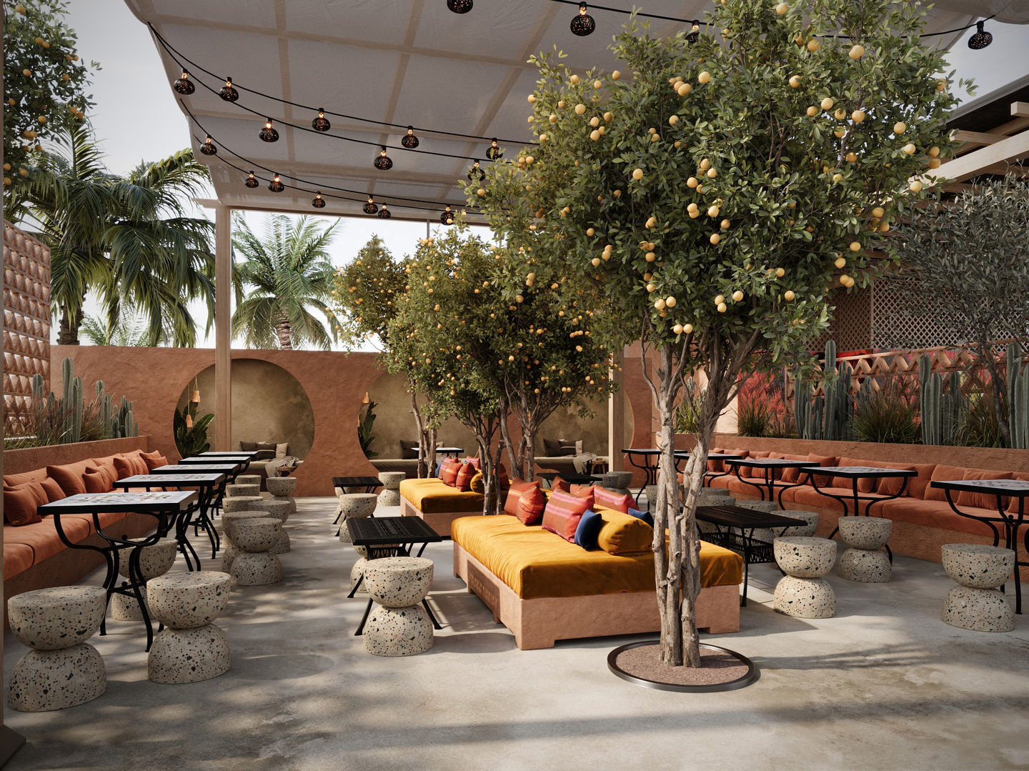 a patio with tables and trees and a yellow couch