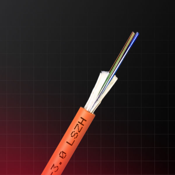 Close-up of an orange fiber optic cable with exposed multicolored strands on a dark grid background, labeled LSZH.