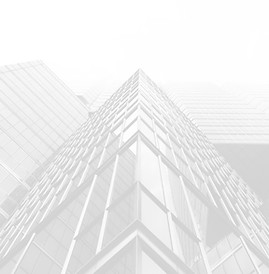 Business building looking up at glass corner on top of building