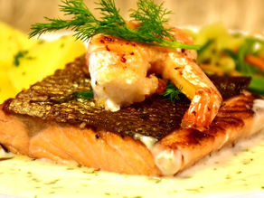 Grilled Salmon and Shrimp with vegetables on a Fish Veloute Sauce
