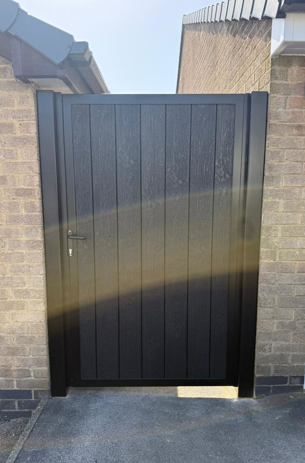 Wide steel-framed side gate with black composite panels