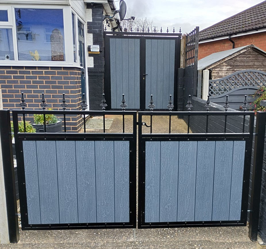 Steel-framed front garden double gates with light grey composite panels and finials