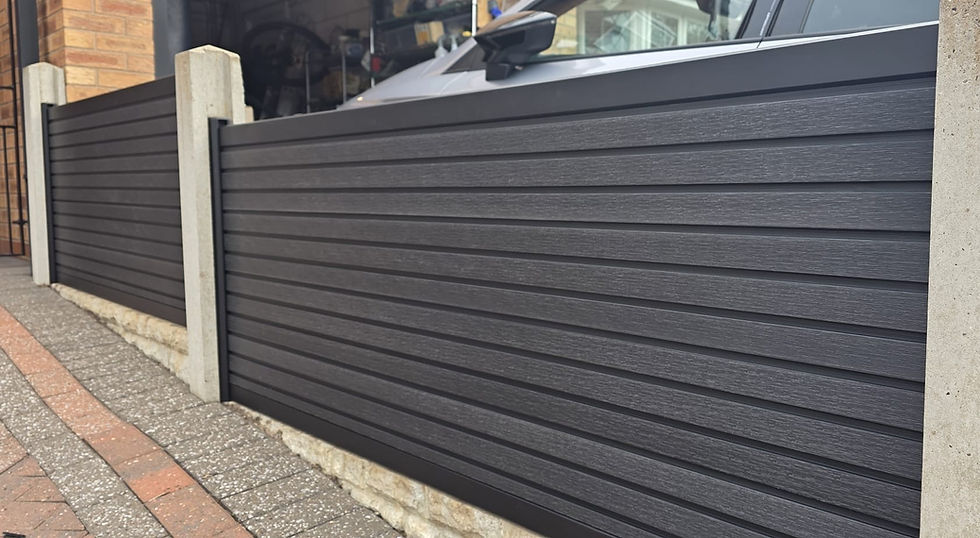 Composite fencing with black slatted panels