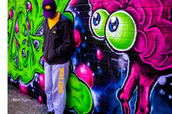 _MG_3690yellow shirt_grey hood- classic back_fancy wall (edit) 