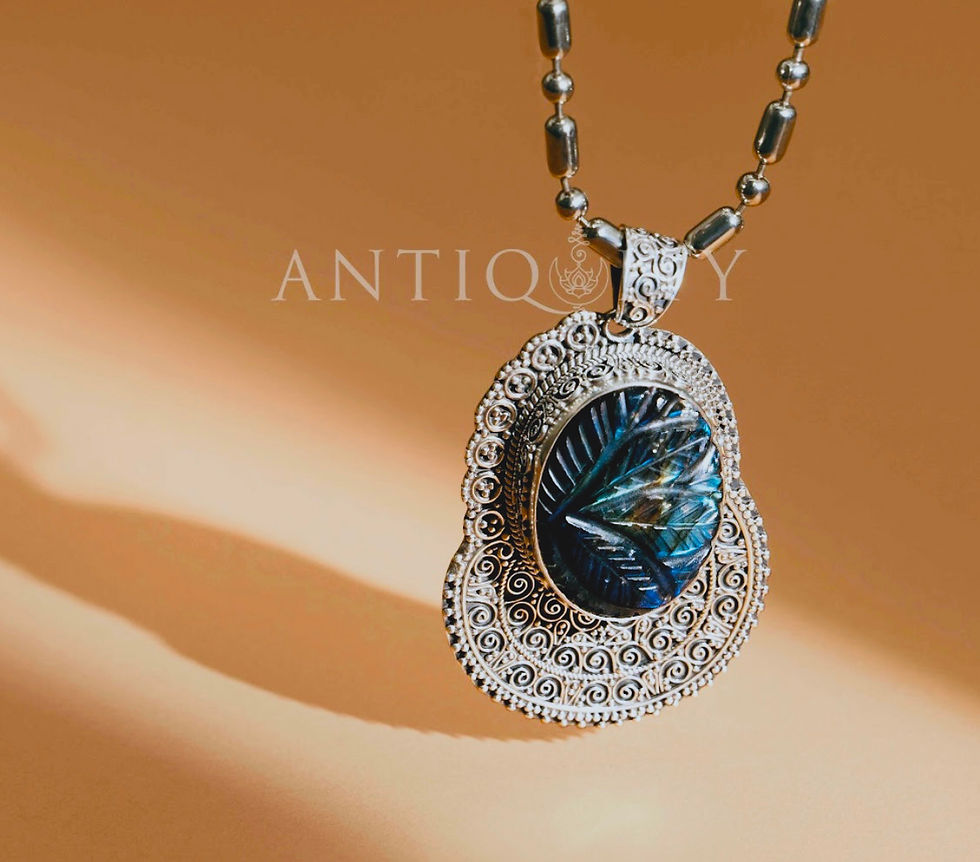 Close-up view of a silver pendant with a deep blue lapis lazuli stone