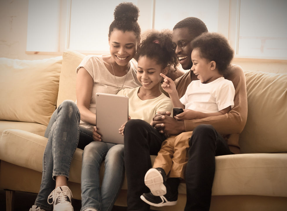 Family sitting on a couch