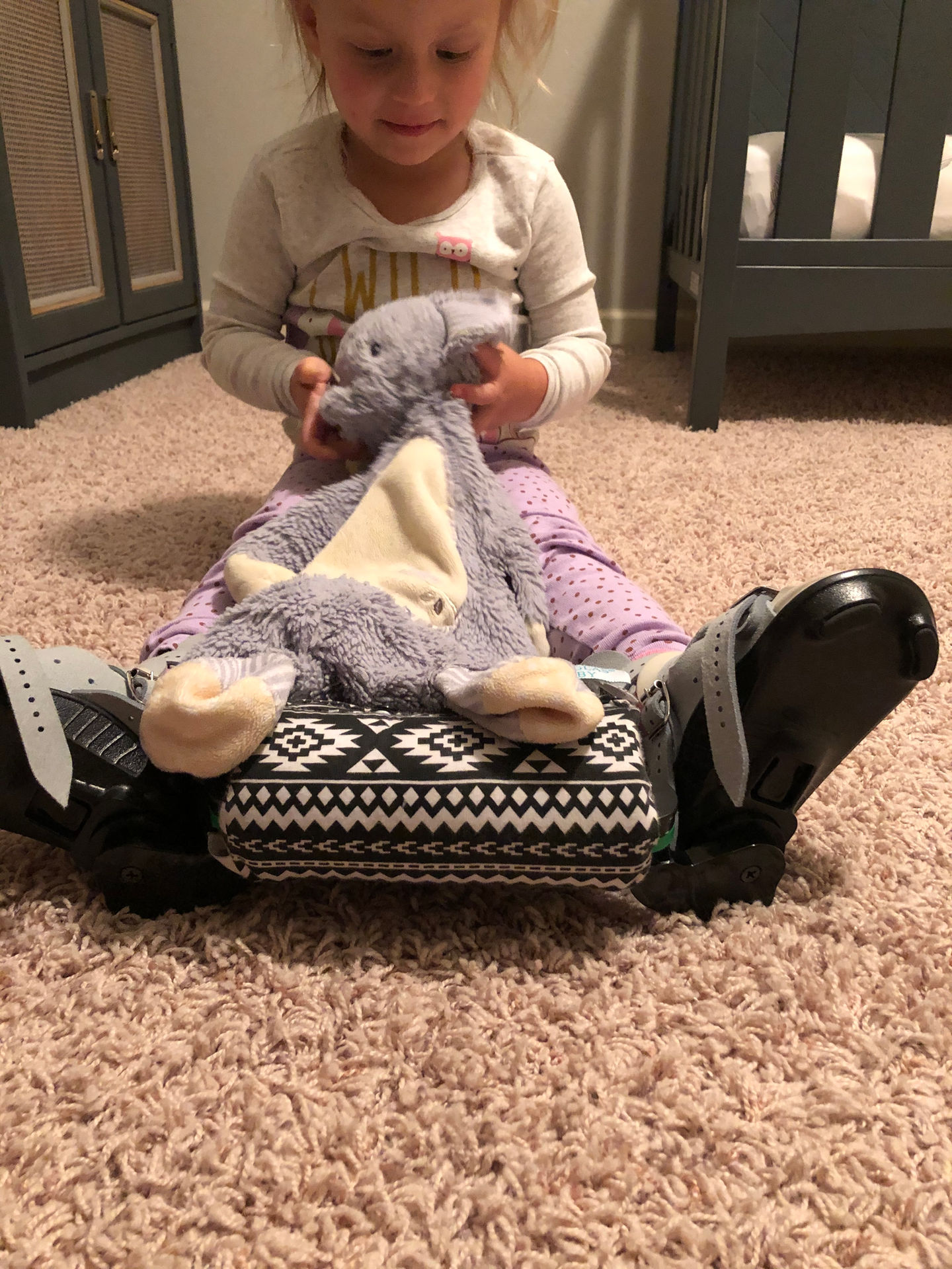 Toddler wearing boots and bar during bedtime