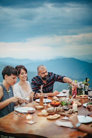 friends enjoying a meal outdoors