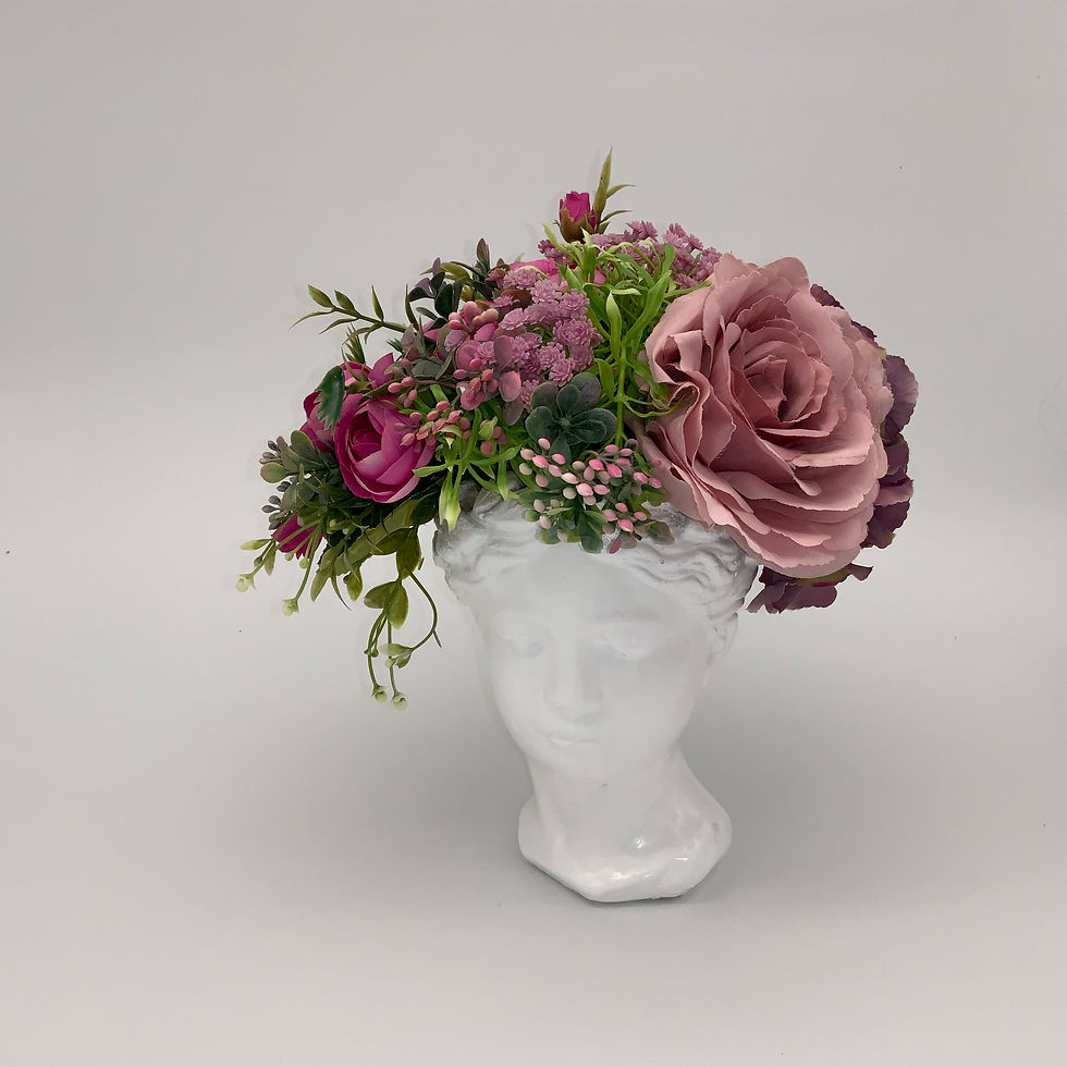 Flower arrangement in a white head vase