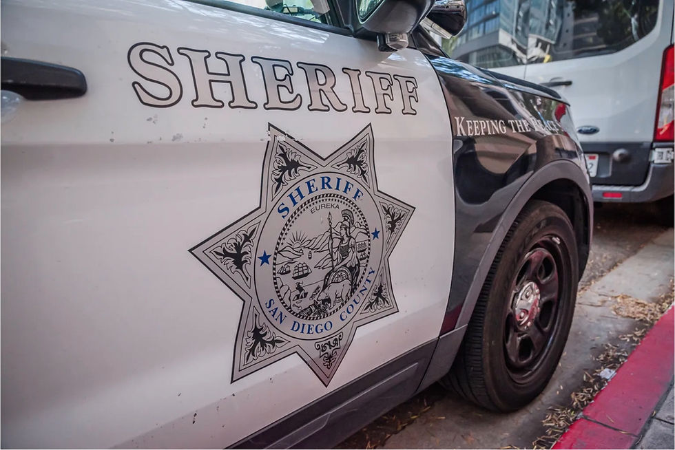 San Diego County Sheriff's shield on their vehicle outside the Sheriff's Intake and San Diego Central Jail building in downtown San Diego on Wednesday, Nov. 5, 2025 | Vito Di Stefano for Voice of San Diego