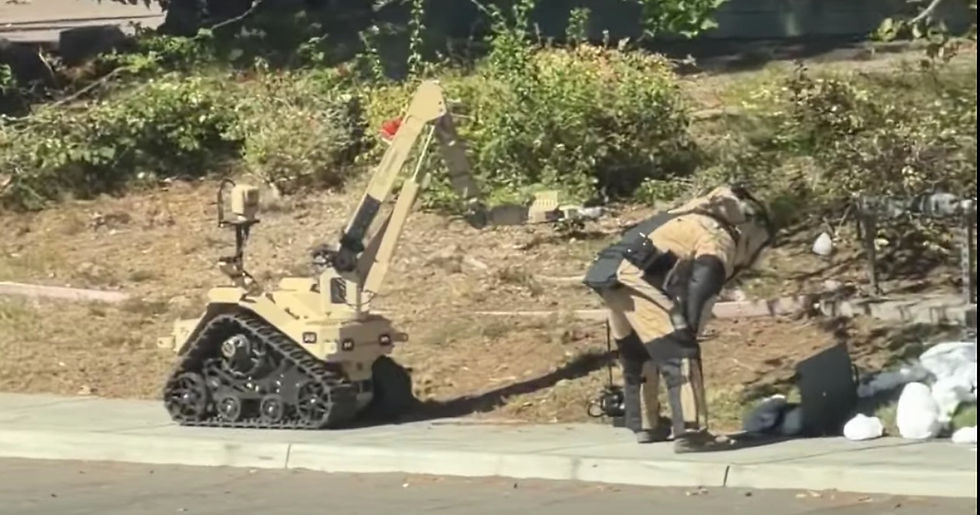 Bomb squad and robot checking out mysterious packages near Naval Air Station North Island (NASNI) entrance at Fourth Street and Alameda Boulevard in Coronado, CA 92118 | Photo from neighbor across the street