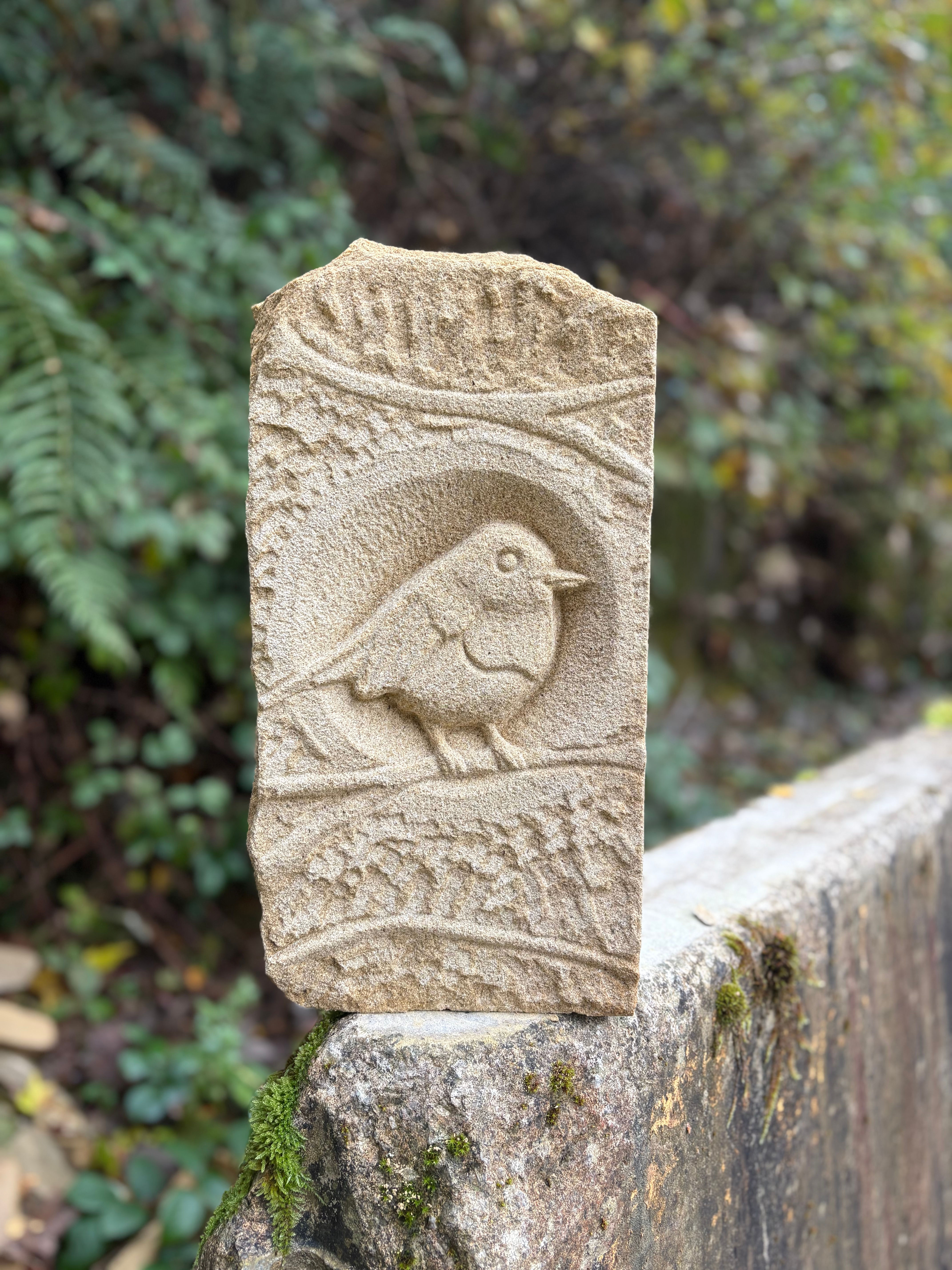 The relief carved robin 16 inches tall x 8 inches in width x 4 inches thick