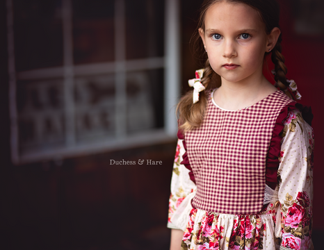 Every Which Way floral dress with gingham plastron tied around the sides.