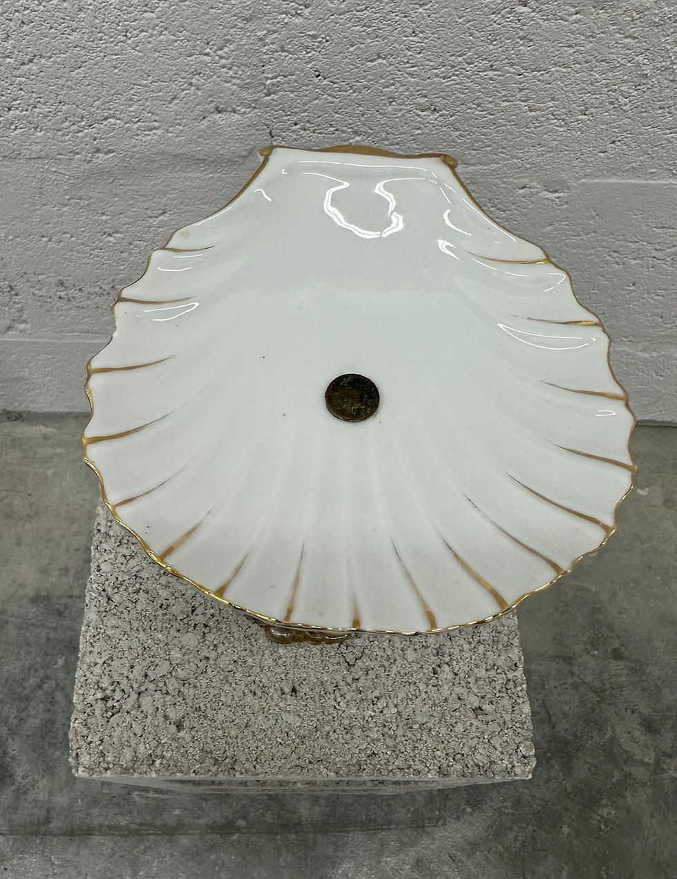 Thumbnail: Gold cherub statue, shell plate.