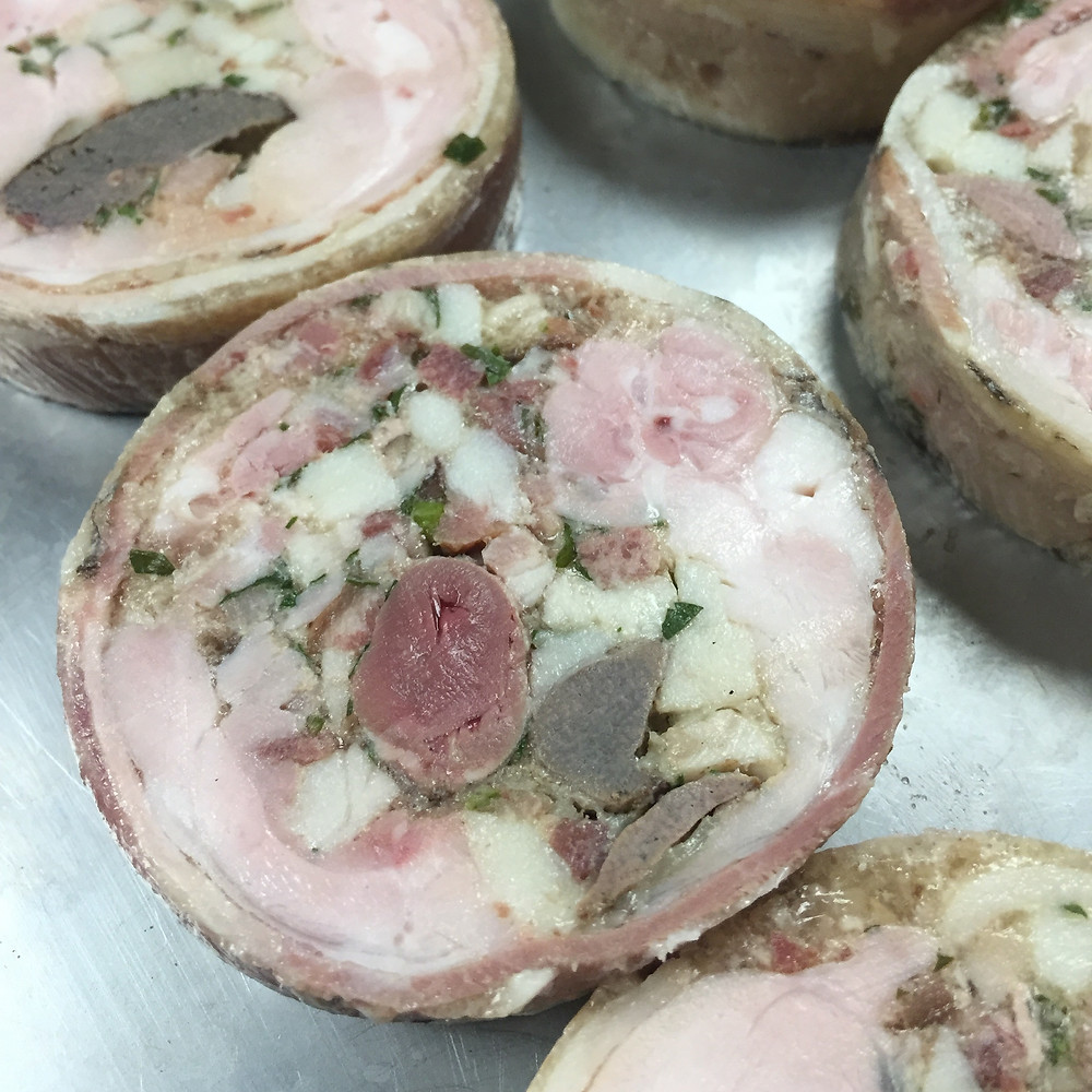 Cross section of the roulade. Note rabbit heart and liver chunks in the middle and at 5:00