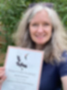 Rachel Johnson holding her Chinese herbal medicine certificate
