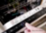 Close up photo of a hand and finger pressing the “Eco” button on a dishwasher control panel.