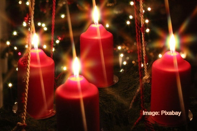 Photo of four lit candles