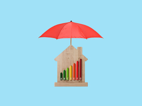 Image of a wood block shaped like a house with an umbrella covering it.