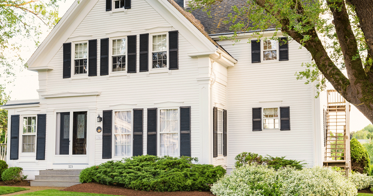 Photo of house with landscaping.