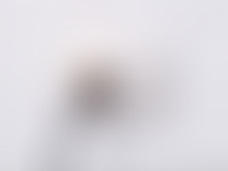 Photo of an electrical wall outlet with an electric cord plugged in. There is a flame rising out of the plug.