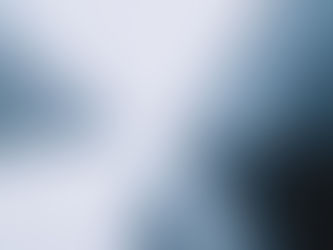 Close-up photo of the side of a black car on a snowy road