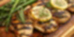 Wood platter with fresh grilled herb lemon chicken 