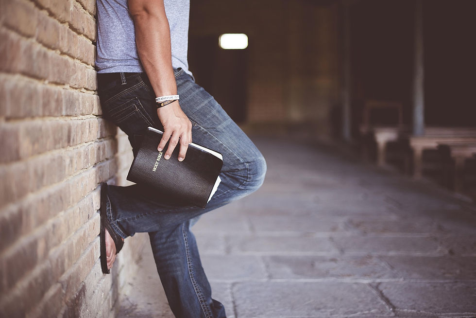 a man holding a Bible