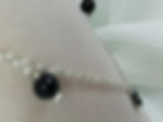 Handmade Dainty hematite hearts and black onyx beads set off this sterling necklace