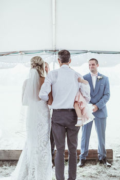 Father of the bride giving the bride away at a wedding ceremony