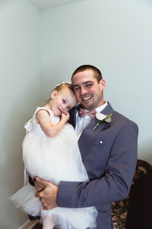 The groom hugging his daughter