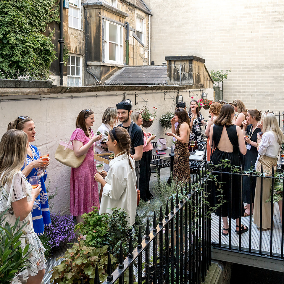 She Shares Event. Women chatting and connecting.