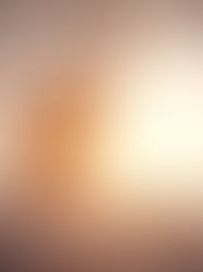 A woman waking up and stretching as sunlight beams through the curtains