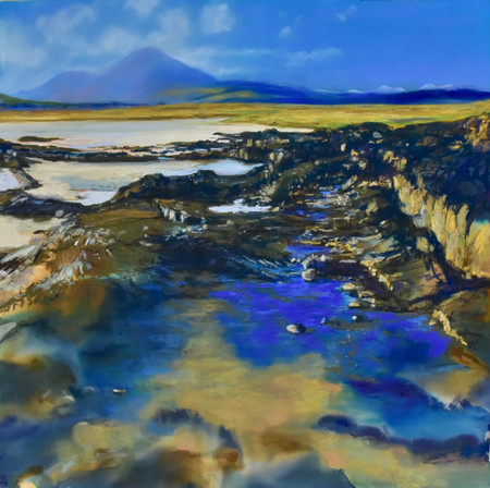 Rock pools on the sandy beach, Broadford Bay, Isle of Skye. Red Cuillin Hills, Blue skies golden sands. Highlands of Scotland. Mountains and rock formations