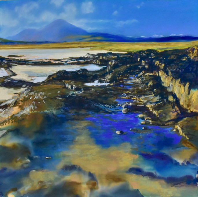 Rock pools on the sandy beach, Broadford Bay, Isle of Skye. Red Cuillin Hills, Blue skies golden sands. Highlands of Scotland. Mountains and rock formations
