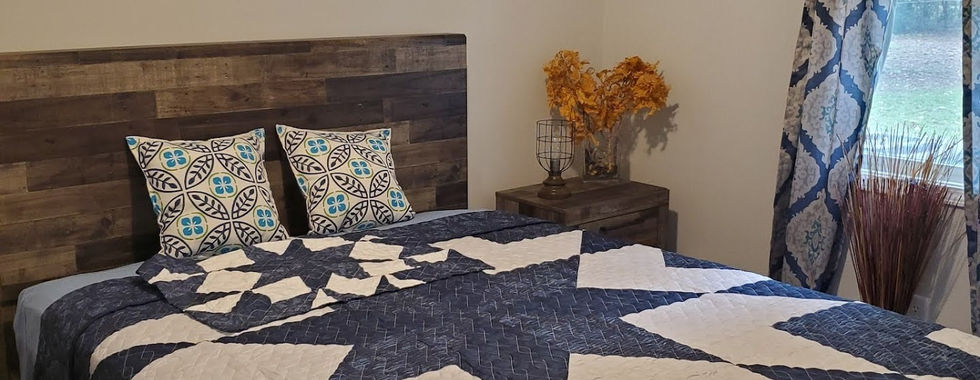 Another bedroom also includes a window and ceiling fan.