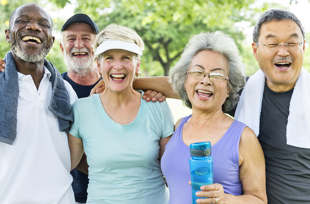 A group of senior citizens are exercising together to create a safe and fun workout routine to help improve their brain health and reduce cognitive decline.