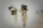 2 soldiers with guns on the battlefield