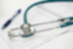 Stethoscope over medical records symbolizing Sensio's healthcare focus