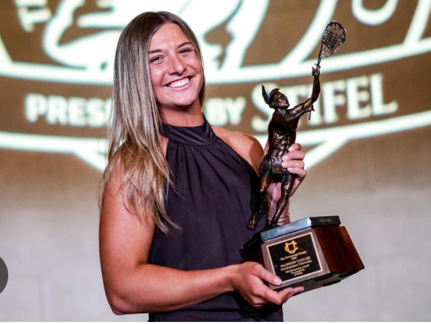 Madison Taylor of Northwestern University posing with the 2026 Tewaaraton Trophy. Taylor beat out North Carolina's Chloe Humphrey, alongside Alyssa Chung of the United States Naval Academy, Brigid Duffy of Army West Point, and Reagan O'Brien of John Hopkins University while being nominated as a finalist for the second year in a row.