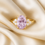 Miniature : yellow gold Celestia Rose Ring resting on a luxury fabric