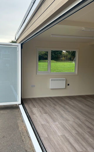 School Shelter conversion to a new Classroom. Large Bifold doors.