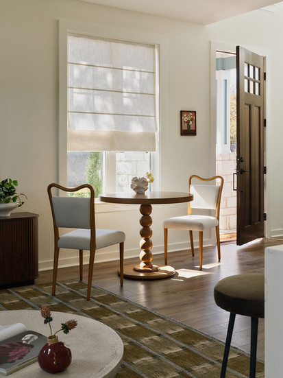 The Drew Lane Entry and dining with two chairs and a bistro table