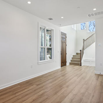 Craftsman Style wood front door next to stairs