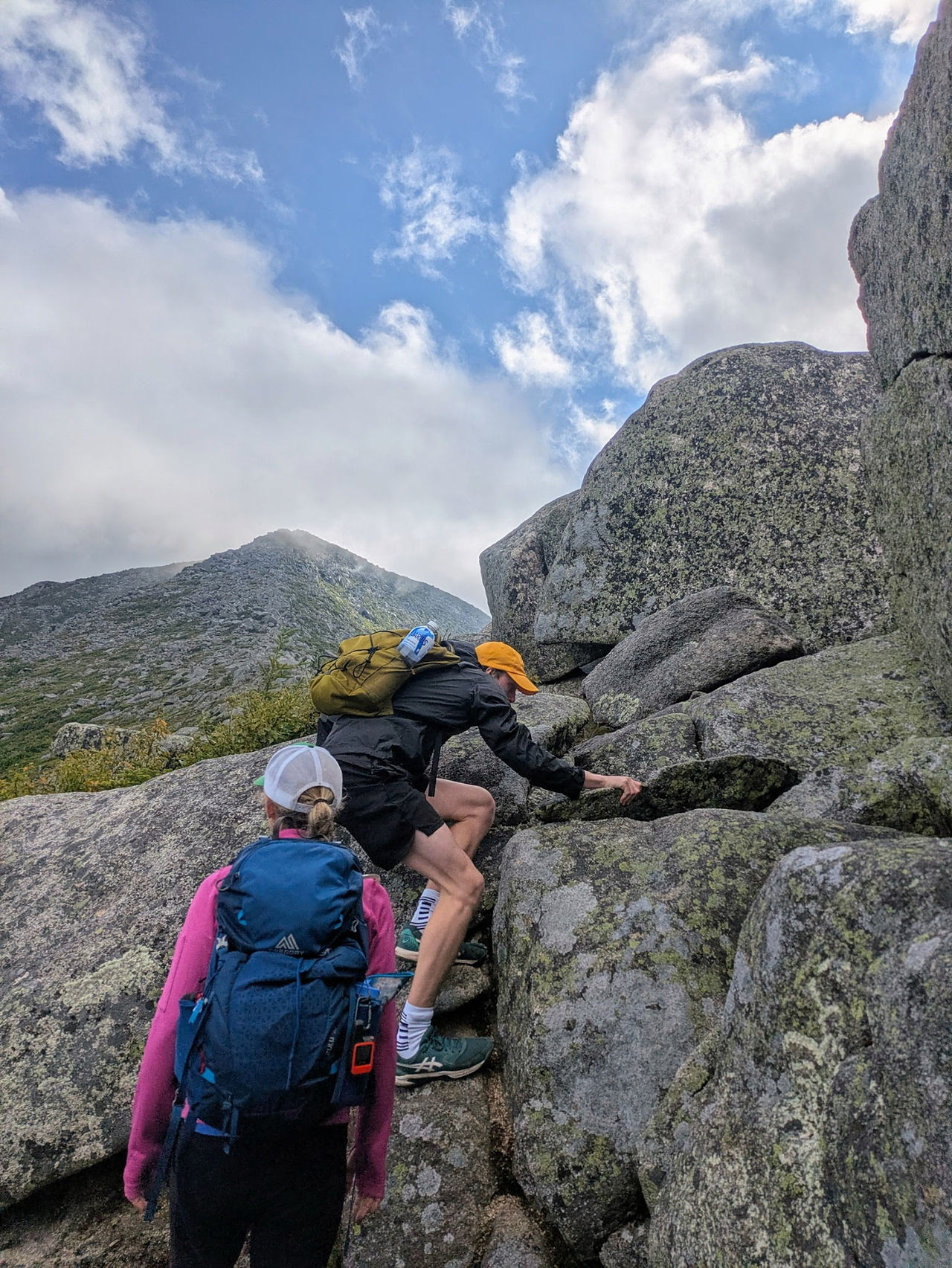 Hikers scale a rocky section of the Hunt Trail leading to Katahdin's Baxter Peak. 