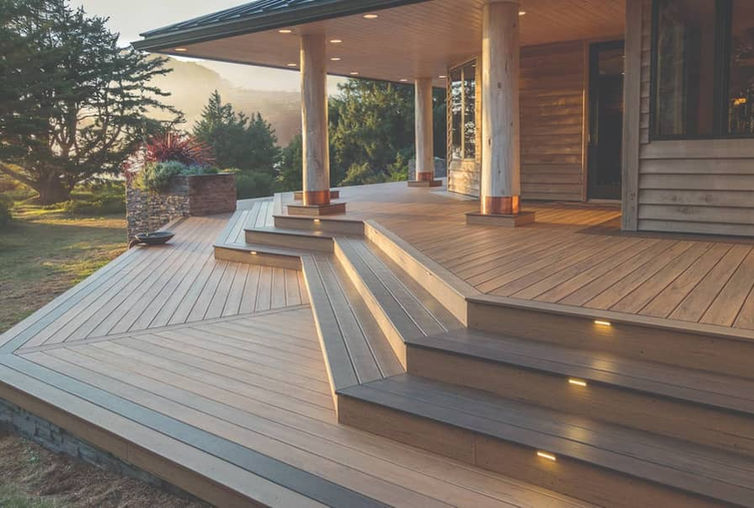 Composite deck steps with built-in lights at covered porch
