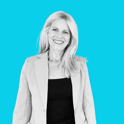 black and white profile photo of Emma Shephard on a light teal background