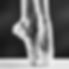 A photo of ballerina's pointes on black
