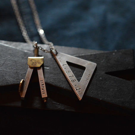 compass and triangle pendant